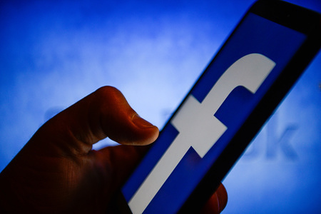 Facebook logo is seen on an android mobile phone.