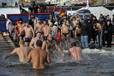 People seen plunging into icy water of the Dnieper river during the Orthodox Epiphany next to St. Pokrov's church.
Epiphany, also known as Theophany in the east, is a Christian feast day that celebrates the revelation of God incarnate as Jesus Christ. In Western Christianity, the feast commemorates principally the visit of the Magi to the Christ Child, and thus Jesus' physical manifestation to the Gentiles.