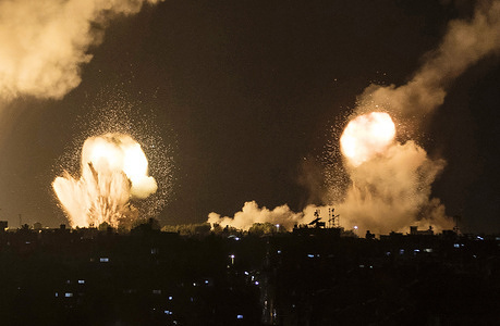 Flames and smoke rise during the Israeli airstrikes in Khan Yunis, in the southern Gaza Strip