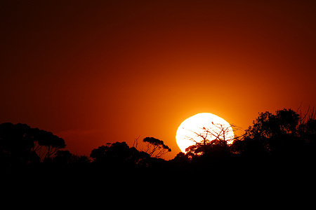 A sunset is seen at Red Cliffs Lookout. Victoria experiences high temperatures today, with Melbourne reaching a maximum of 32°C and regional areas around 39°C. Tomorrow is expected to be hotter, with parts of the state forecast to exceed 36°C.