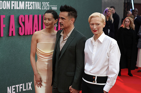 Fala Chen, Colin Farrell and Tilda Swinton attend the "Ballad of a Small Player" UK premiere during the 69th BFI London Film Festival at The Royal Festival Hall.