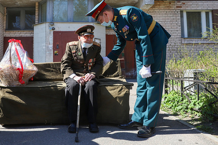 Valentin Roslyakov 106 years old WWII veteran wearing a face mask as preventive measure takes part during the personal parade.This year Victory Day parade was cancelled in Russia to prevent the spread of coronavirus (COVID-19)