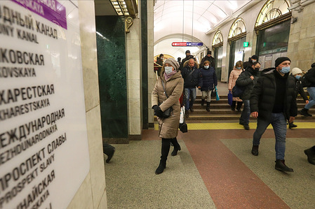 People wearing face masks as a protective measure against the spread of coronavirus (COVID-19) walk around the subway amid coronavirus crisis. Russia has recorded at least 3633952 cases and 67220 deaths by the COVID-19 disease.