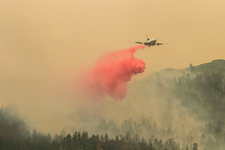 A DC-10 Air Tanker drops fire retardant over the Dixie fire.A spot fire from the Dixie Fire spreads to the highway 395. Cal Fire reports that the Dixie Fire has now grown over 700,000 acres. The cause of the fire is still being investigated.