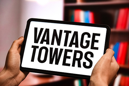 In this photo illustration, the Vantage Towers logo is displayed on the screen of a tablet.