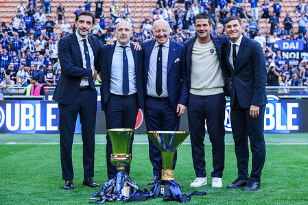 Dario Baccin ,Piero Ausilio, Giuseppe Marotta, Christian Chivu ,Javier Zanetti of FC Internazionale seen posing with the Coppa Campioni d'Italia and Coppa Italia trophies during the Serie A 2025/26 football match between FC Internazionale and Hellas Verona FC at San Siro Stadium. FC Internazionale 1 - 1 Hellas Verona FC
