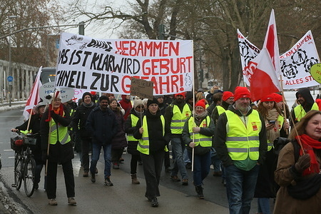 Union members who belong to the German Verdi union seen marching during the protest. Workers are protesting for better working conditions among Verdi union members. In bitterly cold conditions the protest started at the train station before marching through town.