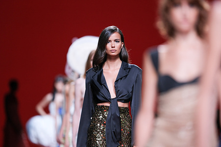 A model walks the runway wearing a creation of Redondo Brand during the presentation new collection at Mercedes-Benz Fashion Week Madrid.