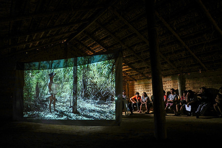 A film screening takes place in one of the indigenous villages of Mongagua, in the Brazilian state of Sao Paulo, on the occasion of a documentary film workshop.