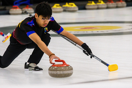 Philippine's Elijah Mojado releases his shot in their opening round victory in the World Curling Junior Mixed Doubles Championship. After the first round, Canada and USA both won their matches, England Lost to Canada (1-10), USA defeated Hong Kong-China (19-1) and Defending Champions Italy lost to Czechia (5-6)
