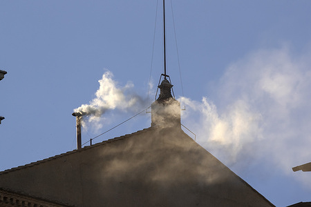 White smoke coming from the chimney on the roof of the Sistine Chapel announces the election of the new Pope Leo XIV.