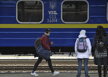 A man wearing a protective mask as a precaution with his bags walking on a railway platform at the central station during the corona virus pandemic.
From noon on March 18 in Ukraine, railway, air and bus intercity and inter regional passenger traffic stops. In addition, stopping the work of subways in cities to counter the spread of the new coronovirus in Ukraine.