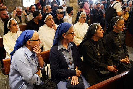 Nuns attend the reopening ceremony of St. Thomas Syriac Orthodox Church after its reconstruction in the old city. The restoration of St. Thomas Syriac Orthodox Church originally dating back to the 7th century was part of the "Mosul Mosaic" initiative aimed at preserving the city's diverse cultural heritage. The project commenced in 2019, led by L'Œuvre d'Orient in collaboration with the State Board of Antiquities and Heritage, the French Institut National du Patrimoine (INP) and the Syriac Orthodox Archdiocese. Funded by the ALIPH Foundation, the restoration included structural repairs, preservation of religious artifacts and community engagement efforts.