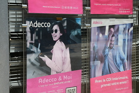 A poster at the Adecco employment recruitment agency at Peage de Roussillon.