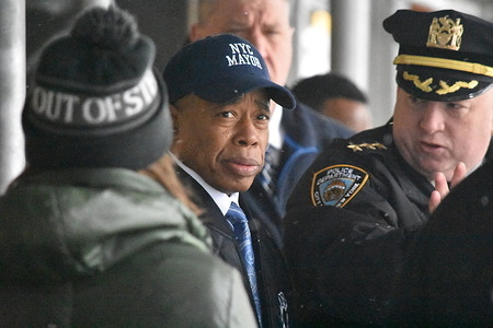 New York City Mayor Eric Adams talks to authorities during his visit at the shooting scene after which he departs without taking questions from press. The New York City Police Department investigates a shooting in Manhattan of a 17-year-old male who was shot in broad daylight on West 68th St and Amsterdam Avenue. The 17-year-old victim was transported to hospital. The shooting happened near the Martin Luther King Jr. Educational Campus.