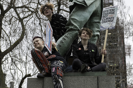 Youths are seen seen with placards next to a sculpture at Parliament Square during the protest.
Hundreds of young people gathered at Parliament Square, joining the Global Climate Strike and demanding from the government and politicians direct actions to tackle the climate change. Students in more than 100 countries went to the streets to participate in a climate global strike.