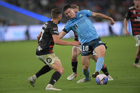 Joseph Lolley (front) of Sydney FC, Dylan Pierias (L) and Oscar James Moncrieff Priestman (back) of Western Sydney Wanderers FC are seen during the Isuzu UTE A-League 2023-24 season round 24 match between Sydney FC and Western Sydney Wanderers FC held at the Allianz Stadium. Final score Sydney FC 2:1 Western Sydney Wanderers.