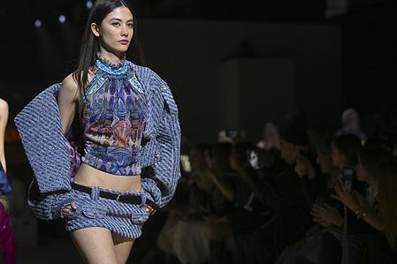 A model walks the runway wearing a design by Custo during the Mercedes-Benz Fashion Week de Madrid in IFEMA.