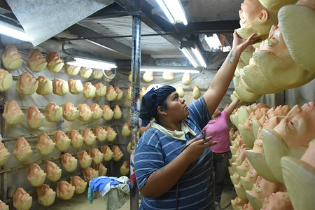 A worker girl seen manufacturing masks of the U.S. president Donald Trump in Cuernavaca, Mexico.
