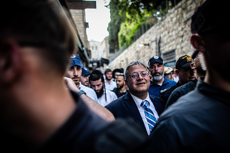 Israeli Minister of National Security Itamar Ben-Gvir marches through the Muslim quarter of Jerusalem's old walled city. Tens of thousands of young religious-Zionist and right-wing Israelis marched through Jerusalem, waving Star of David flags and entering the Old City via the Muslim Quarter. The controversial Flag March marks the city's reunification during the Six-Day War and Israel's capture of the Temple Mount and Western Wall, Judaism's holiest sites.