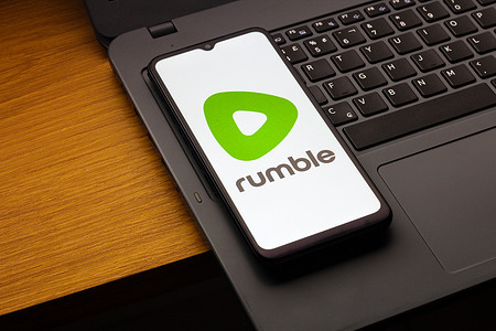 In this photo illustration, the Rumble logo is seen displayed on a smartphone screen.