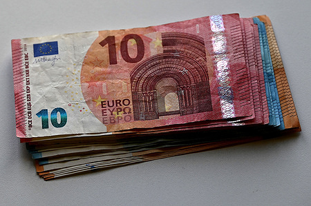 In this photo illustration, a bundle of 10, 20 and 50 euro banknotes is seen displayed.