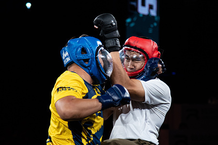 Thai policemen participate in the Cops Combat competition at Rajadamnern Stadium. The Cops Combat competition is a martial arts tournament for members of the Thai Policemen held at the Rajadamnern Stadium by the Royal Thai Police aimed at making Thai policemen aware of the importance of close-quarter combat.