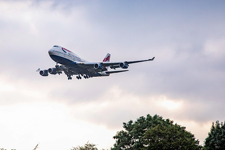 British Airways Boeing 747 Jumbo Jet aircraft with registration G-BYGD seen on a final approach flying and landing at London Heathrow LHR International Airport.