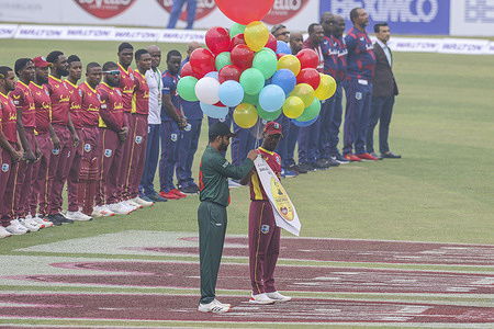 Bangladesh's captain Tamim Iqbal (L) and West Indies' captain Jason Mohammed release balloons before the start of the first one-day international (ODI) cricket match at the Sher-e-Bangla National Cricket Stadium in Dhaka.