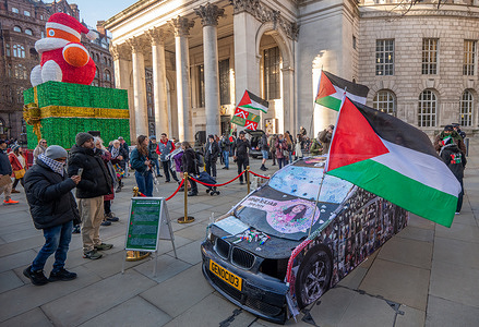 Replica of the car in which 6-years old Hind Rajab was killed signed and stickered by protesters during the demonstration. Protest to commemorate 8th December 1987 when 4 Palestinians were killed by Israeli soldiers outside of Jabaliya refugee camp in Gaza. Palestinians responded with the First Intifada. A replica of the car in which 6-years old Hind Rajab was killed on 29/01/2024 Hind spent her last moments pleading on the phone to emergency workers. Israeli forces also killed six of her family members and two paramedics coming to her rescue.