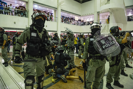 Police officers form a protective circle around their fellow officers while making arrests inside a shopping centre during clashes.
Pro-democracy protesters assembled at various districts throughout Hong Kong in support of the anti-extradition movement. Large crowds attempted to gather at several malls where they faced off with heavy police forces. Protesters continue to reiterate their 5 demands despite the government's unwillingness to negotiate further.