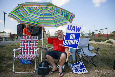 Workers from United Auto Workers Local 440 picket at an entrance of General Motors' Bedford Powertrain factory during the first day of a national labor strike against GM. The strike involving over 49,000 workers nationwide began at midnight. Over 700 work at the Bedford plant. The United Auto Worker union is leading it's first nationwide strike against General Motors (GM) since 1982, seeking to fight for jobs and more benefits which will cost the company dearly for an indefinite period of time.