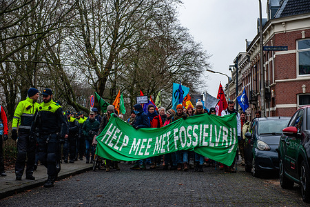 Police officers are seen accompanying the protesters during the demonstration. Activists from Extinction Rebellion walked slowly on several roads in the city, blocking the traffic. This action is the response to a new gas power plant that may be built on the site where a coal-fired power station was closed just a few years ago.