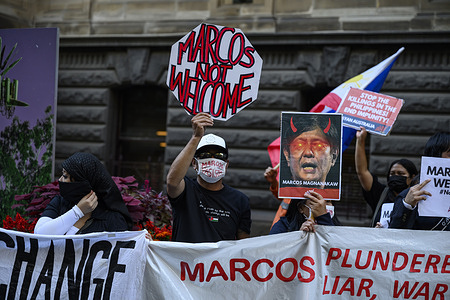 Protesters hold signs outside the Melbourne Town Hall during the demonstration. New Patriotic Alliance (BAYAN) Australia protesters gathered for a demonstration outside the Melbourne Town Hall during the ASEAN Summit 2024 where Philippine President Ferdinand Marcos Jr. attended. BAYAN Australia denounced the US-Marcos regime, citing threats to Philippine democracy and independence. They expressed concerns over President Ferdinand Marcos Jr.'s policies, impacting Filipinos' rights and welfare. The protesters demanded the withdrawal of US troops from the Philippines and the Asia-Pacific region.