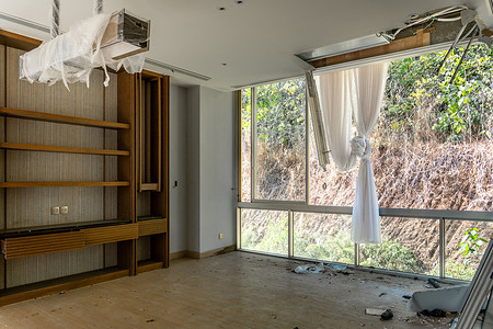 A view of an abandoned living room in a show villa at Aquarius Residences & Resort, Bang Bao subdistrict, Koh Chang Island, Thailand. Launched in 2019 by Aquarius International Development (AQI), Aquarius Residences & Resort was announced as a US$250 million luxury real-estate and resort project on Koh Chang Island, Thailand, owned by Hong Kong–based Norcal Venture Capital Group. The 145-rai (23.2-hectare) development was planned to include villas, condominiums, retail space, and a 200-room hotel under The Chedi brand, with openings slated for 2022–2023. Although two show villas and a sales gallery were completed in 2021, construction stalled at the marketing stage, and as of 2026 the project has never opened.