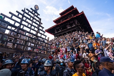 People gather in large numbers as they observe the Jatra on the main day of the 'Indra Jatra' festival at Basantapur Durbar Square. The annual festival, named after Indra, the god of rain and heaven, is celebrated by worshipping, rejoicing, singing, dancing, and feasting in Kathmandu Valley to mark the end of the monsoon season. Indra, the living goddess Kumari and other deities are worshipped during the festival.