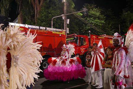 One of the banner carriers of the samba school Acadêmicos do Salgueiro waits before entering the Sambadrome avenue, during the parade. The Rio Carnival took place from February 13th to February 21st, 2026. The Rio Carnival Special Group samba school competition brings together the top-ranked samba schools, which parade in the Sambadrome with floats and costumed performances that were evaluated by judges to determine the annual champion.