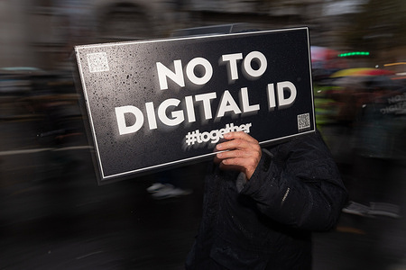 A demonstrator holds a placard reading “No to Digital ID” during the rally. Protesters marched in London to oppose the government’s proposed mandatory digital ID scheme, warning it threatens privacy, freedom, and civil liberties. The demonstration brought together a cross-section of citizens demanding that identity not become a tool of surveillance and control.