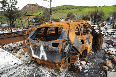 A burned car is seen in the aftermath of the deadly Woolsey wid fire in Agoura Hills, California.
Thousands of fire fighters battled the 2018 Woolsey brush fire in southern California as tens of thousands of people were under mandatory evacuation. 1500 destroyed - 341 damaged, structures were destroyed and damaged, 3 fire fighters were injured and 3 civilian fatalities encountered. The cause of the fire is still uncertain.