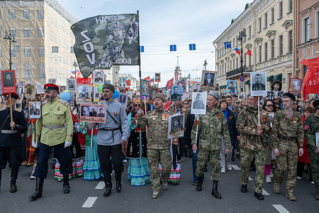 People carrying portraits of relatives who fought in World War II take part in the “Immortal Regiment” march celebrating Victory Day on Nevsky Prospekt. Victory Day commemorates the Soviet Union’s victory over Nazi Germany in World War II (known in Russia as the "Great Patriotic War") in 1945. It symbolizes national resilience, sacrifice, patriotism in memory of the 27 million Soviet citizens who lost their lives.