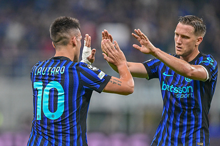 Lautaro Martinez (L) and Piotr Zieliński of Inter celebrates a goal during the UEFA Champions League match between Inter and Slavia Prague at Giuseppe Meazza stadium. Final score Inter 3 : 0 Slavia Praha