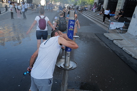 A man cools off in Paris as the high temperatures continues across the French capital. High temperatures in France and many other parts of Europe.
People fill bottles with water in Paris today as the heatwave continues across Europe. There has been reports of a number of heat-related issues and authorities have been under pressure to deal with fires caused by the heatwaves.