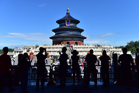 Silhouettes of people seen during the festival at the temple of Heaven Park.
Held on the 15th day of the 8th month of the Chinese lunisolar calendar, the mid Autumn Festival is the second most important holiday after Chinese New Year. Held on a full moon day, people celebrate with friends and family. Special lanterns are hung and 'moon cakes' eaten among other festivities.