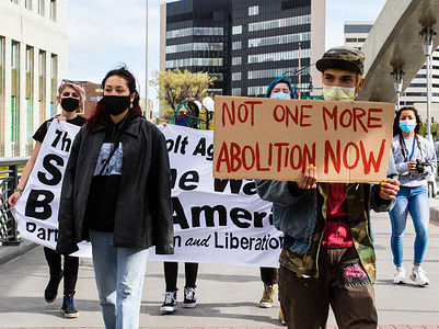 Protestors marching through downtown holding signs during the protest.
Protesters gathered for an Anti-Police Violence event hosted by the party for Socialism and Liberation. The protest remained peaceful but did encounter hecklers.