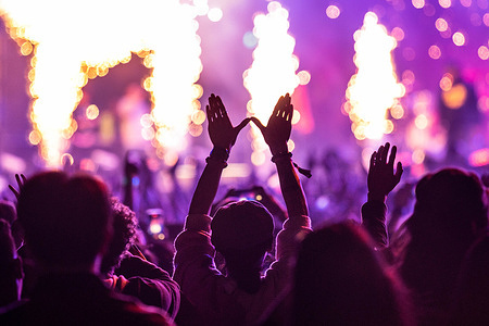An audience member makes the 'W' sign for the Wu-Tang Clan as they close out the Clockenflap Festival on the main stage. After a four-year hiatus due to the Hong Kong protests and covid-19 pandemic, Clockenflap returned with a sold-out festival from March 3-5, 2023. As Hong Kong's biggest outdoor music event, Clockenflap featured many local and international bands and was one of the first events to take place after the Hong Kong Government lifted most social distancing rules.