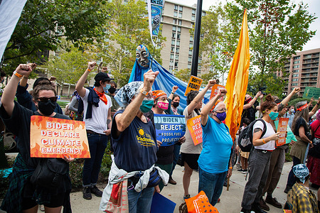 Protesters hold placards while making gestures during the demonstration.Water protectors and indigenous activists demonstrated outside the apartment of Jaime Pinkham of the U.S Army Corps of Engineers asking him for a meeting to discuss pollution ravaging the water and air of communities across the United States.