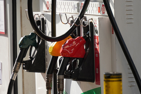 Fuel nozzles seen displayed on a Sinopec oil dispenser. Affected by the rise in international crude oil prices and in accordance with refined oil pricing mechanism, the country will implement a new round of fuel price adjustments on March 23.