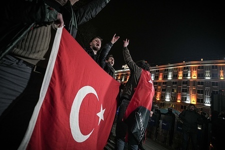 Protesters raise the Turkish flag as they make the "grey wolf" sign, a symbol of nationalists and chant slogans during the demonstration. Following images of the "flag being lowered" in Nusaybin district, located on the Turkish border, nationalist groups gathered in Ankara to protest and condemn the attack on the Turkish flag.