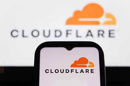 In this photo illustration, a Cloudflare logo is displayed on a smartphone.