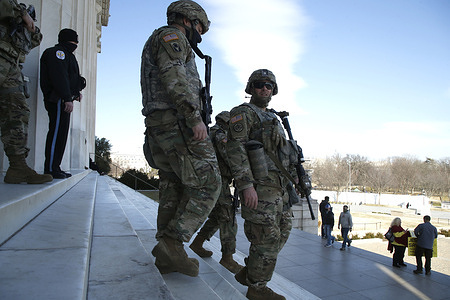 Florida National Guardsmen stand on guard around the Lincoln Memorial on the National Mall. 
According to news sources neither the FBI nor Homeland Security made an announcement regarding lowering the present security level around the US Capitol and downtown Washington DC.